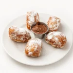 Warm fluffy beignets served as a sweet dessert at Eggsquisite Cafe.