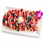 Sweet breakfast choices at Eggsquisite Cafe including pancakes, crepes, waffles, French toast, and cinnamon French toast with optional fruit and toppings.