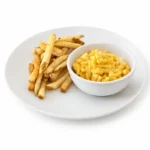 Creamy kids macaroni and cheese at Eggsquisite Cafe served with French fries.