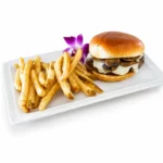 Mushroom Swiss Burger at Eggsquisite Cafe with Angus beef, sautéed mushrooms, and melted Swiss cheese.